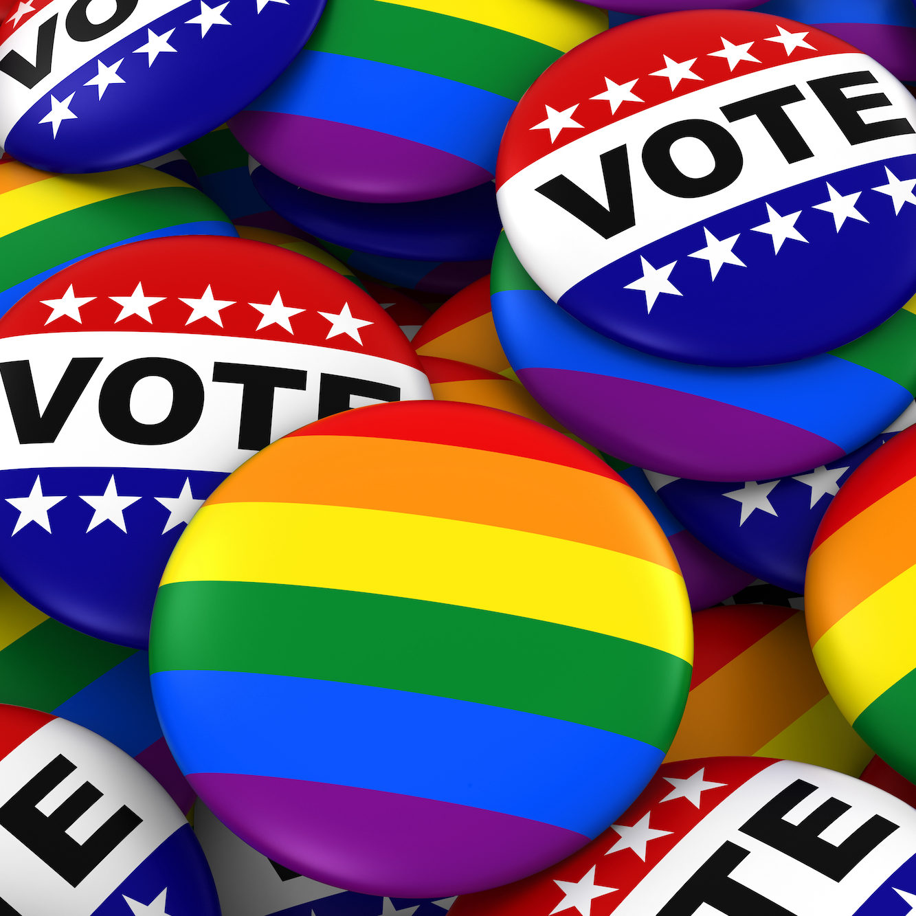 Vote & LGBTQ+ pride buttons in pile